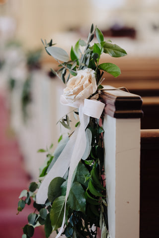 Aisle floral pew marker wedding decor.