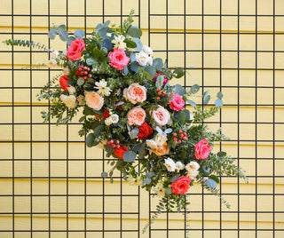 Ceremony flowers for wedding reception couples table.